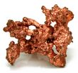A crystal of a coppery-colored metal mineral of standing on a white surface