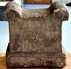 Symbolic base with a cuneiform inscription and depiction of Tukulti-Ninurta I, 13th century BCE. From Assur, Iraq. Pergamon Museum.jpg