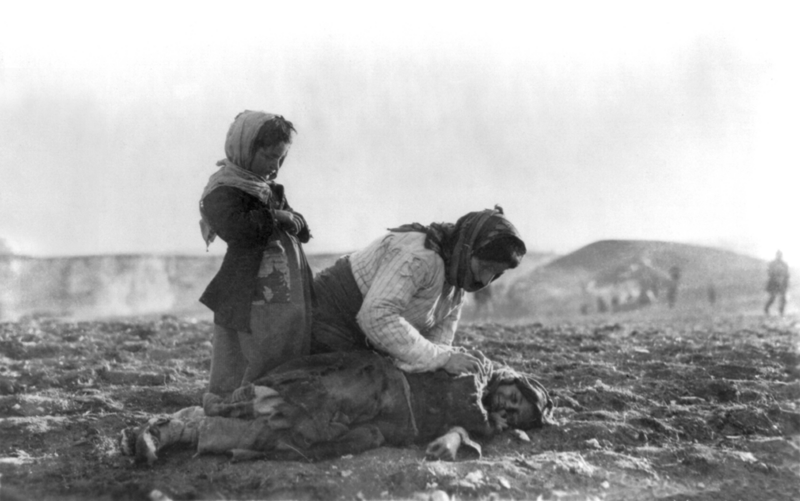 File:Armenian woman kneeling beside dead child in field.png