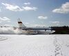 NASA 515 during braking test run on snow-covered runway at Brunswick Naval Air Station.