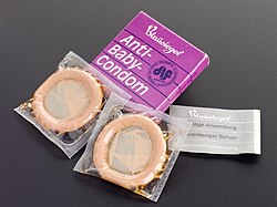 Shows purple packet of "Anti-baby" condoms from Germany. c1980s.