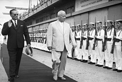Photograph of Khruschev and Tito reviewing a line of sailors