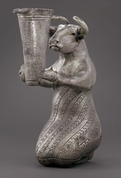 File:Proto-Elamite kneeling bull holding a spouted vessel.jpg