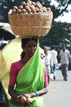 Mysore woman balancing basket.jpg