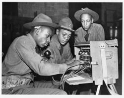 3 men working on a portable phone switchboard.jpg