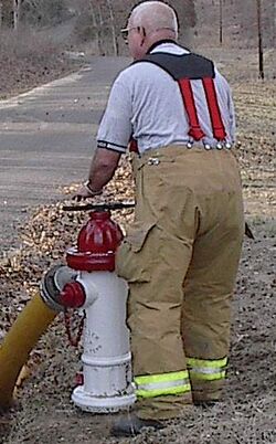 Fireman uses hydrant.jpg