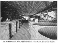 A large room filled with wine barrels