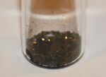 Black lumps in a glass beaker