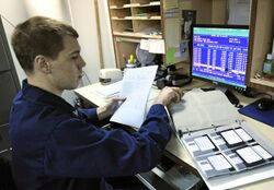 US Navy 110129-N-7676W-152 Culinary Specialist 3rd Class John Smith uses the existing DOS-based food service management system aboard the aircraft.jpg