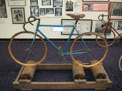 Antique bicycle on antique rollers in US Bicycling Hall of Fame.jpg