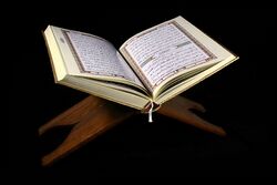 Quran opened, resting on a stand