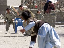 Children playing cricket in the streets of Pakistan
