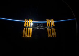 STS-119 International Space Station after undocking with earth atmosphere backdrop.jpg