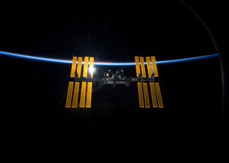File:STS-119 International Space Station after undocking with earth atmosphere backdrop.jpg