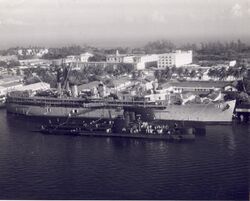 USS Howard W Gilmore AS-16 1960s with subs.jpg