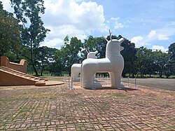 Northern view of the classical colossal statues of Kanglasha, the Meitei mythical Dragon Lion God, located inside the Kangla Fort in Imphal.jpg