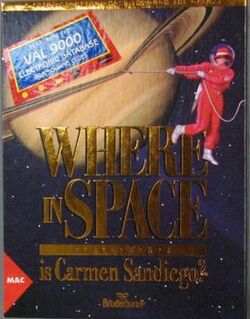 The glossy box cover for "Where in Space" features Saturn, its rings having been lassoed by Carmen Sandiego (who's wearing a red spacesuit and bubble helmet over her hat). The text "Where in Space Is Carmen Sandiego?" can be read, as well as a label declaring "Featuring the VAL 9000 electronic database for solving clues"; a Broderbund logo is at the bottom, and a labeled triangle identifies this box art as belonging to the Apple Macintosh version of the game.