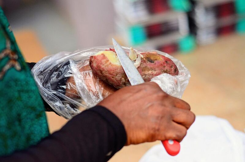 File:A seller peeling a sweet potato.jpg