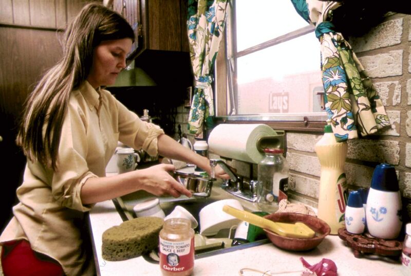 File:HOUSEWIFE IN THE KITCHEN OF HER MOBILE HOME IN ONE OF THE TRAILER PARKS. THE TWO PARKS WERE CREATED IN RESPONSE TO... - NARA - 558298.jpg